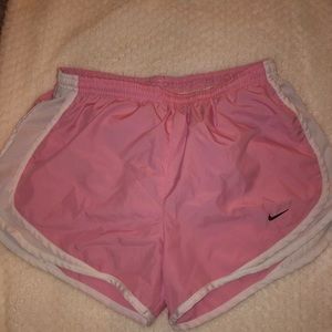 pink and white Nike running shorts